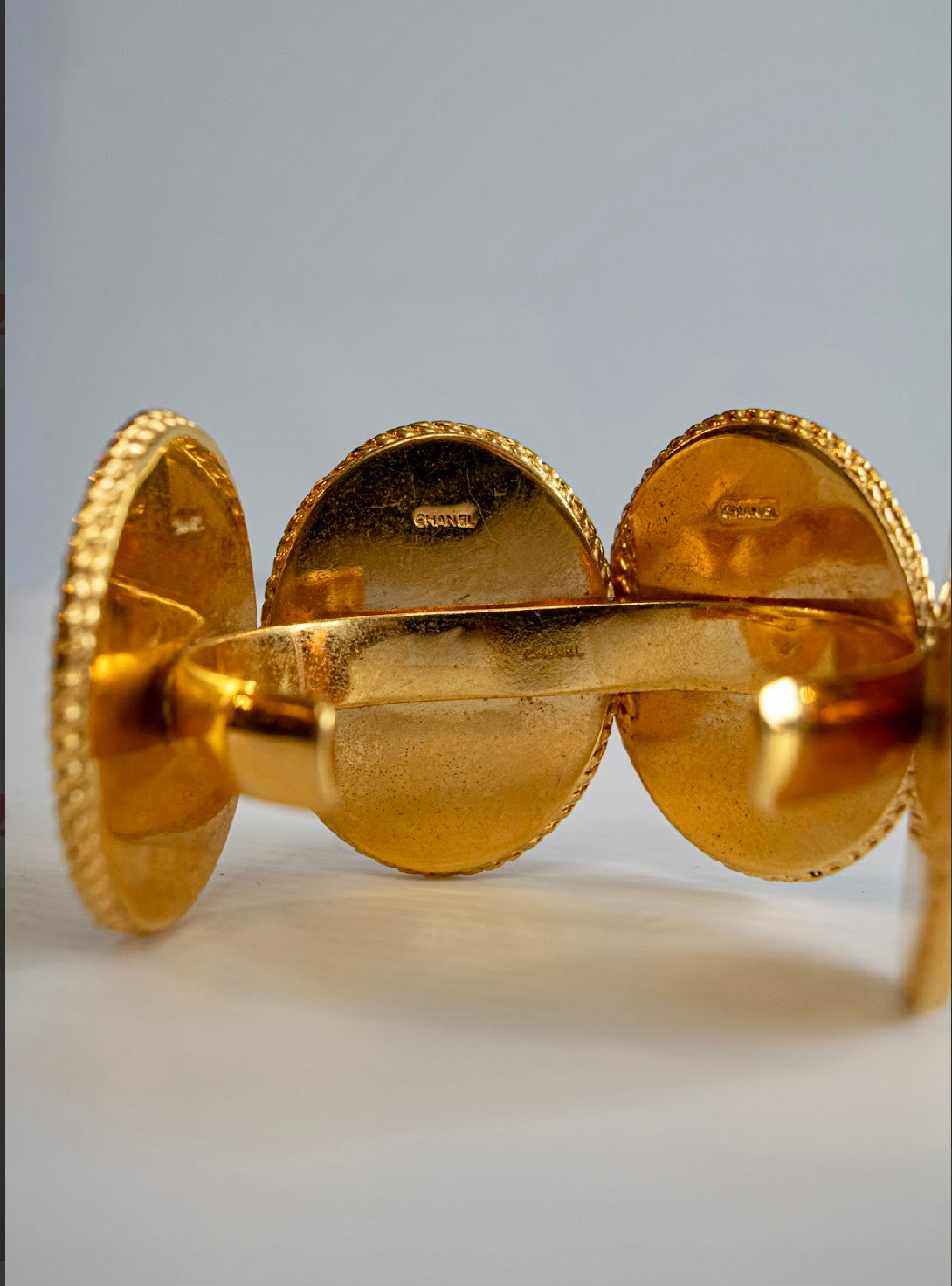 Chanel 1990s carved cameo motif large cuff bracelet with 4-cameo 2" cameo plates featuring a horse, 2 Coco portraits and a renaissance girl.