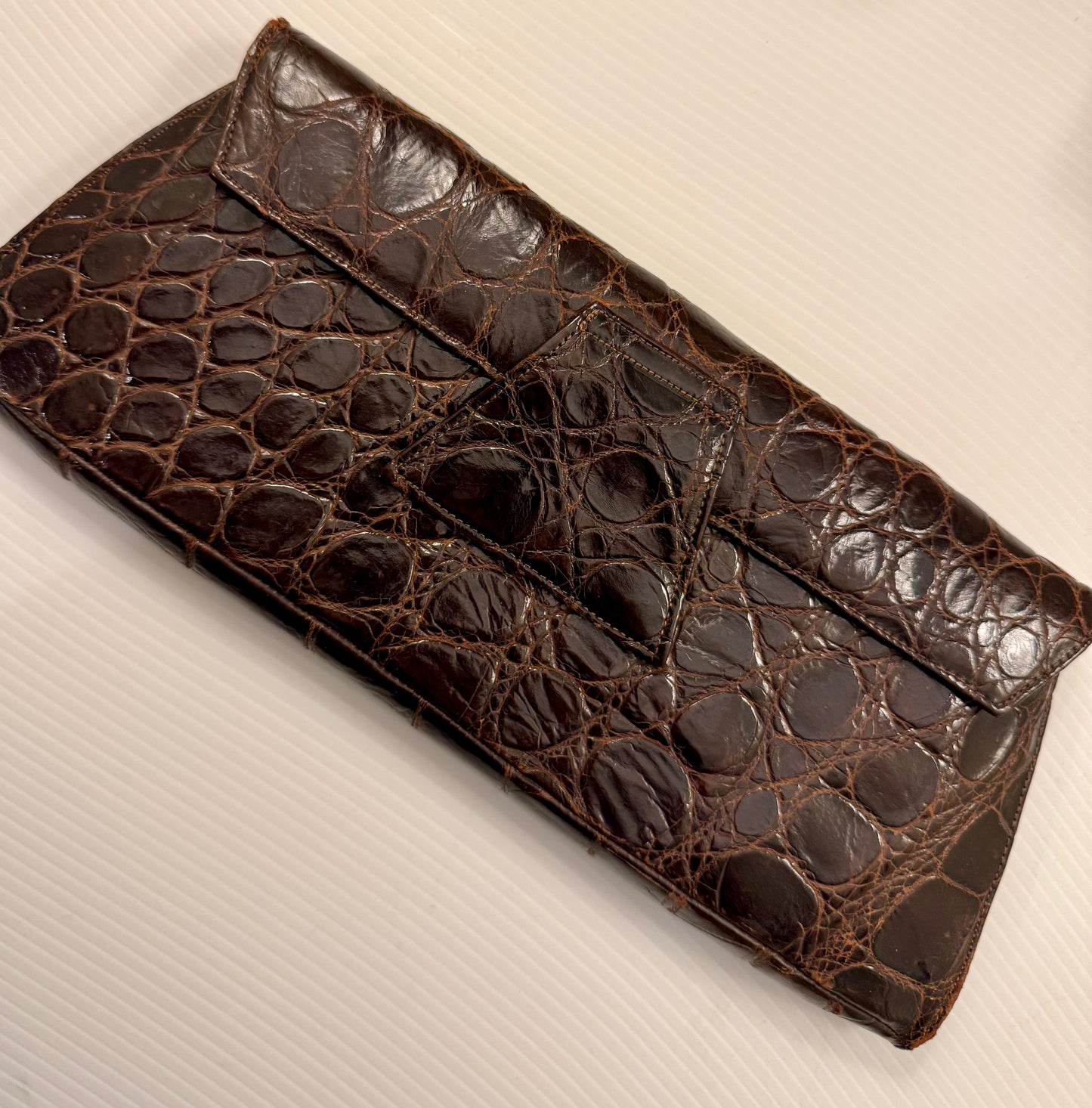 1950s brown crocodile clutch with change purse, original mirror and belt strap in back