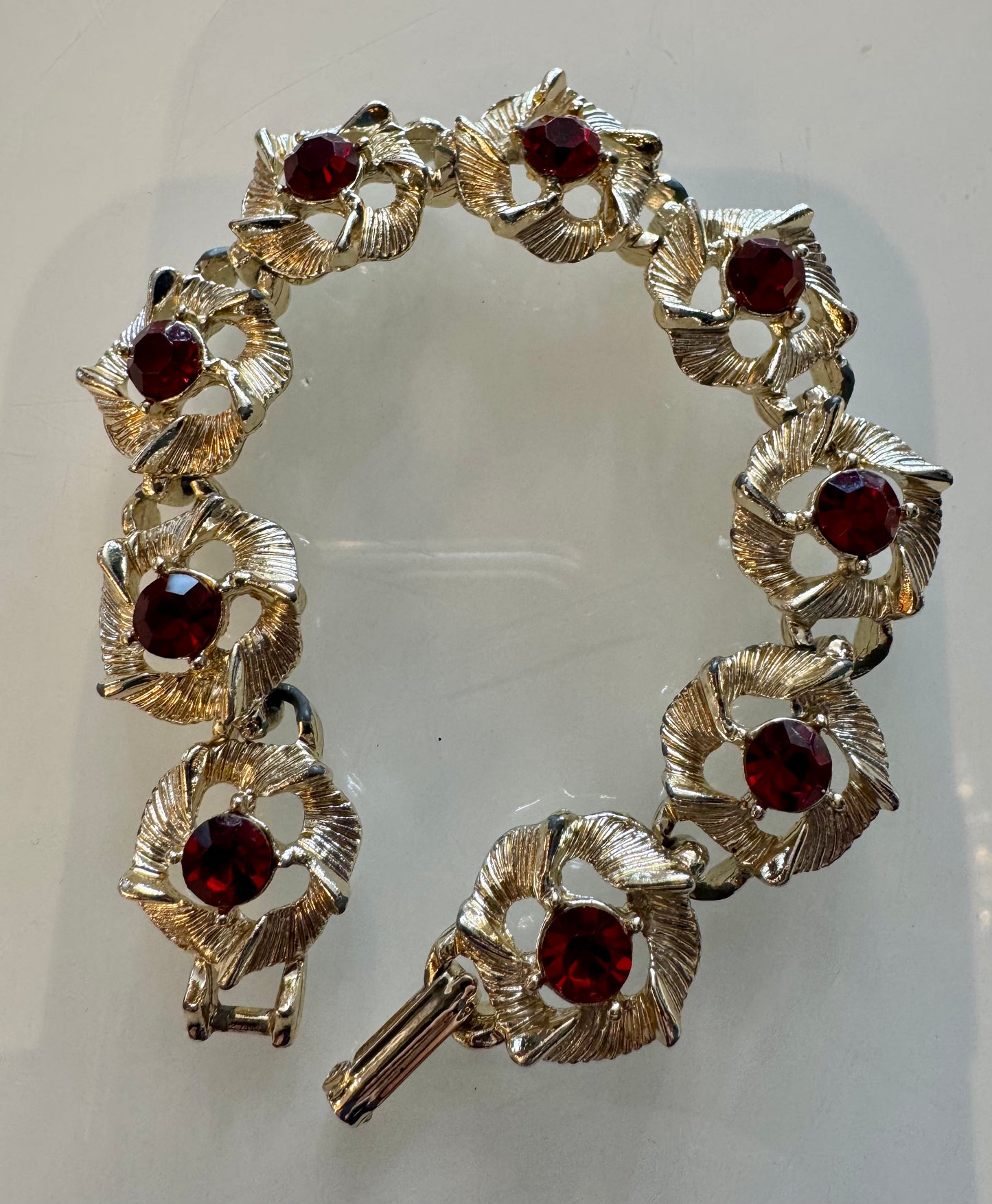 Vintage silver tone bracelet with red rhinestones