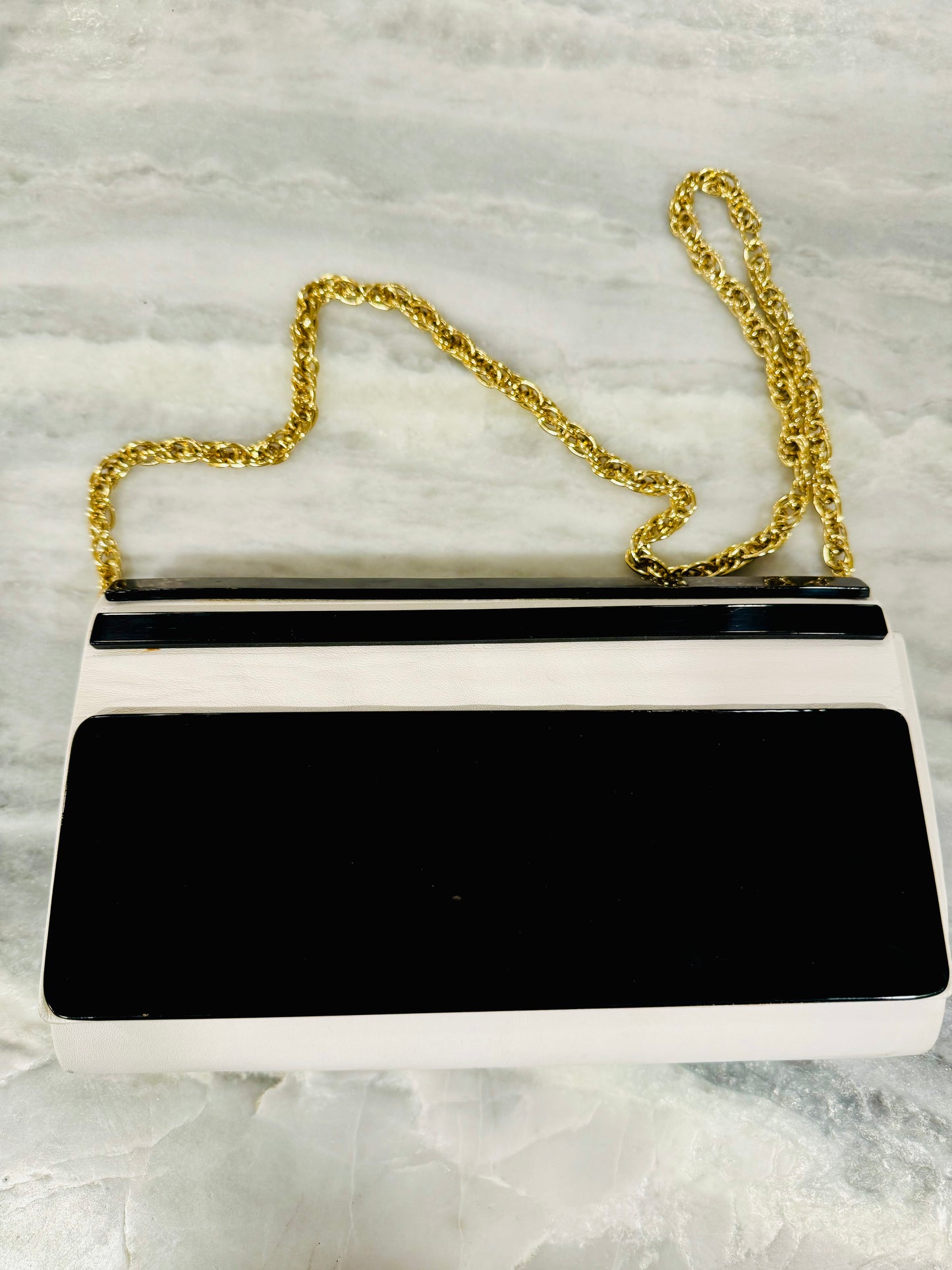 Vintage black lucite and white leather convertible clutch with gold tone chain bag. Made in Italy for Plymouth