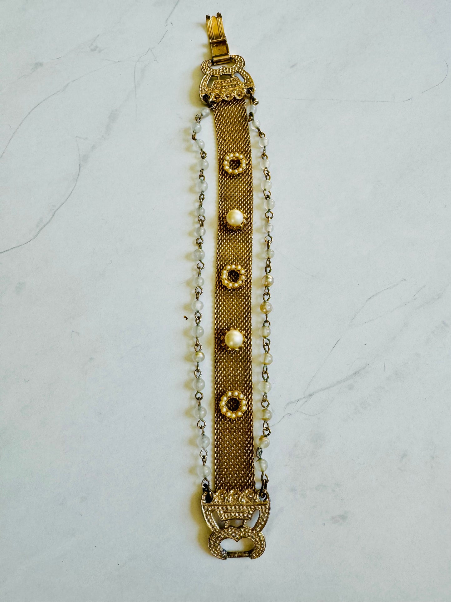 Stunning 3 strand 1950s gold tone and pearl bracelet with gorgeous clasp. Looks like you've stacked, but it's all one piece