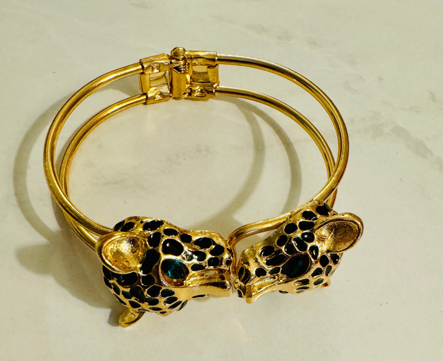 Vintage leopard gold tone clamper bracelet with green rhinestones