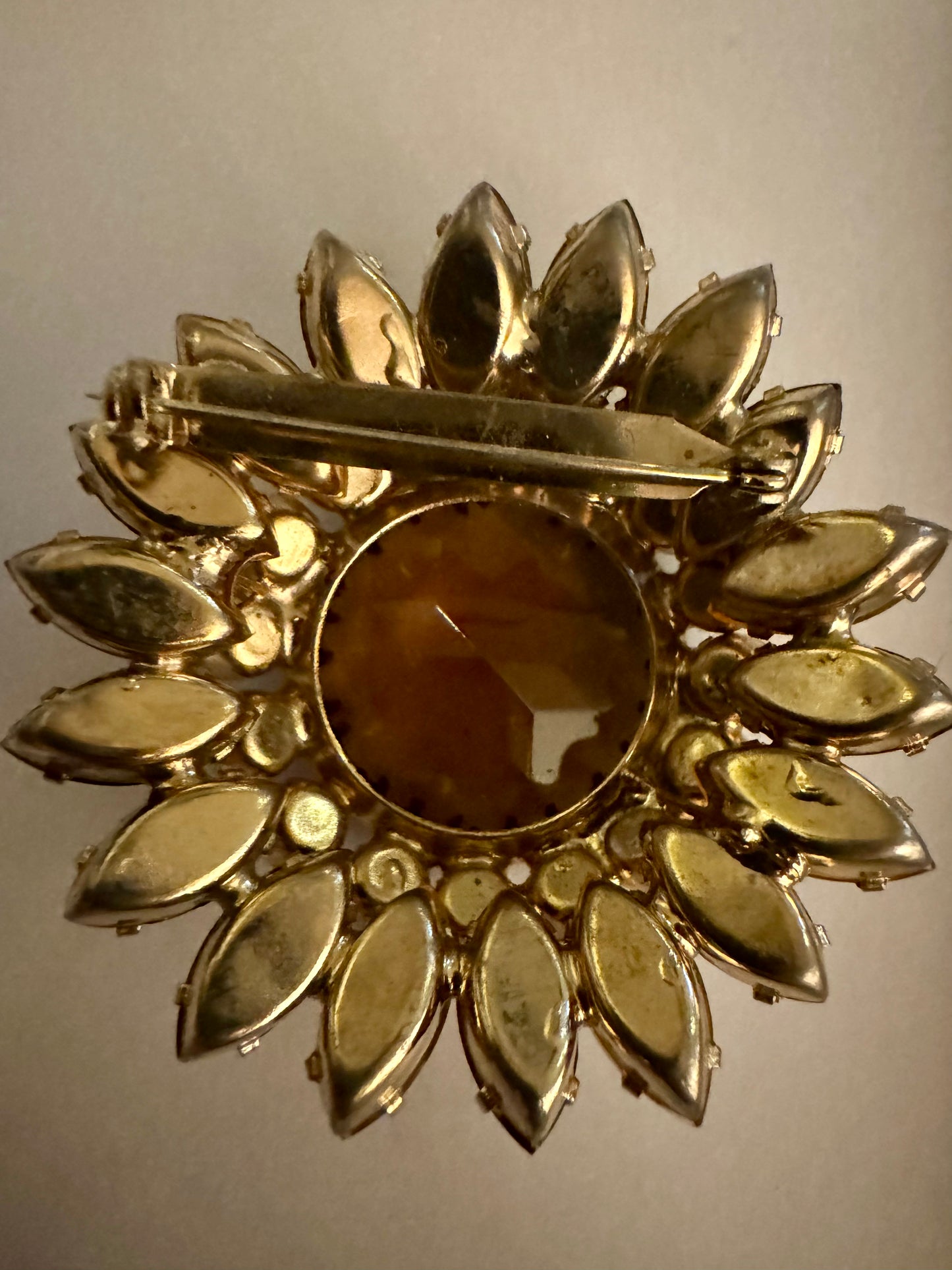 Amber colored rhinestone brooch