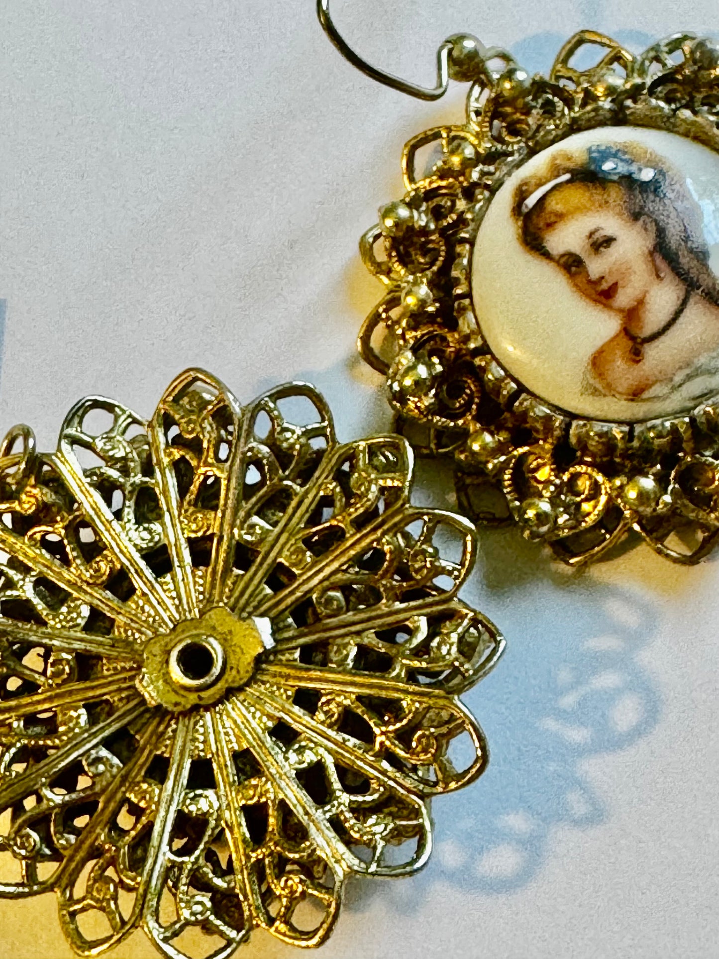 Vintage cameo earrings with filagree gold tone detail