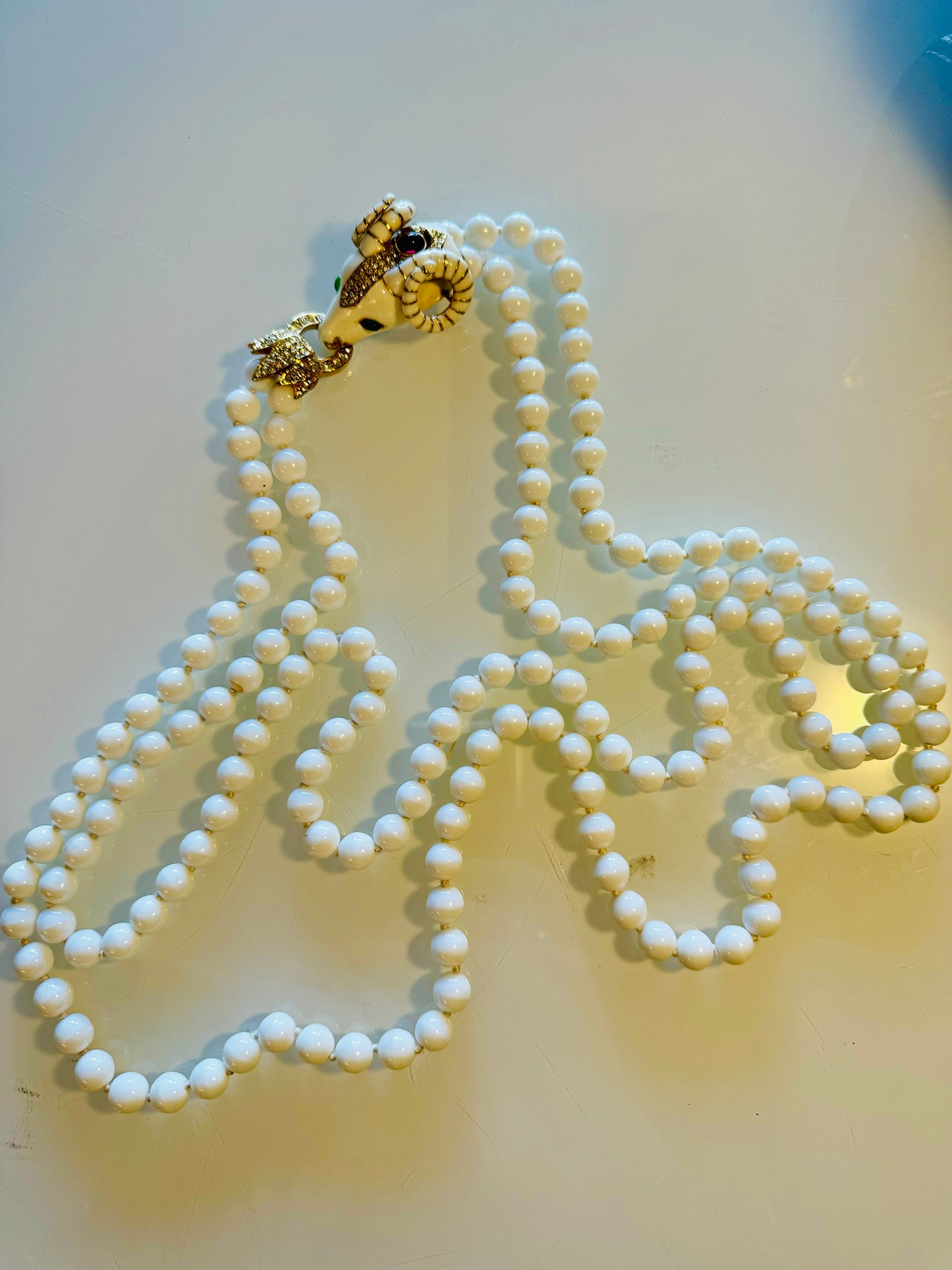 Vintage signed CINER 2 strand RAM necklace with crystal cabochon and hand knotted white glass pearl
beads