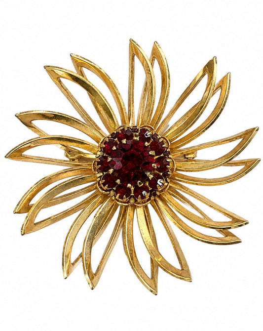 1970s signed SARAH Coventry gold tone flower brooch with red rhinestone center