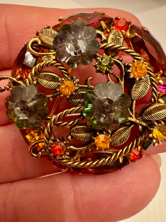 Stunning amber rhinestone round brooch