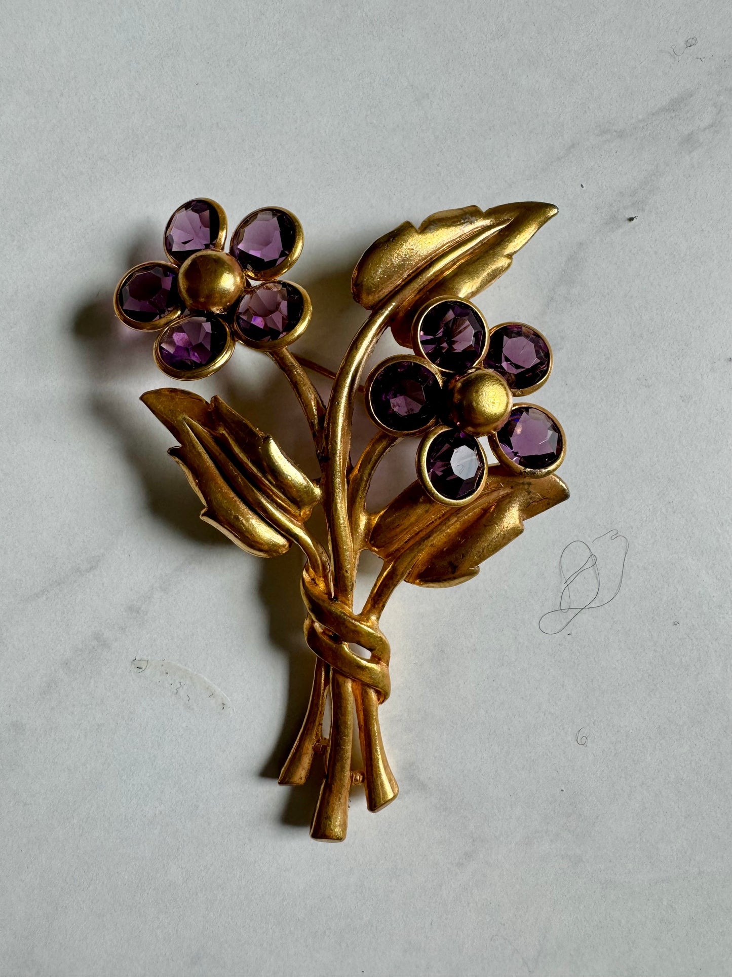 Vintage gold tone flower bouquet brooch with amethyst petals