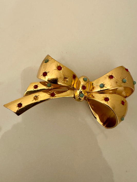 Beautiful vintage gold tone bow brooch with colored stones