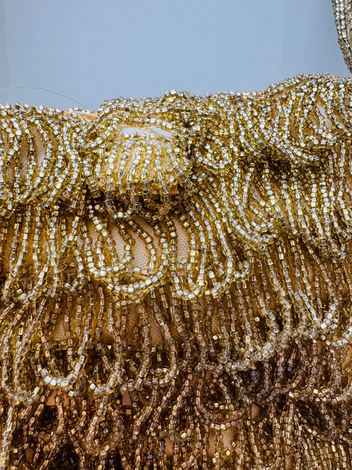 Chic gold beaded fringe bag with yellow satin lining