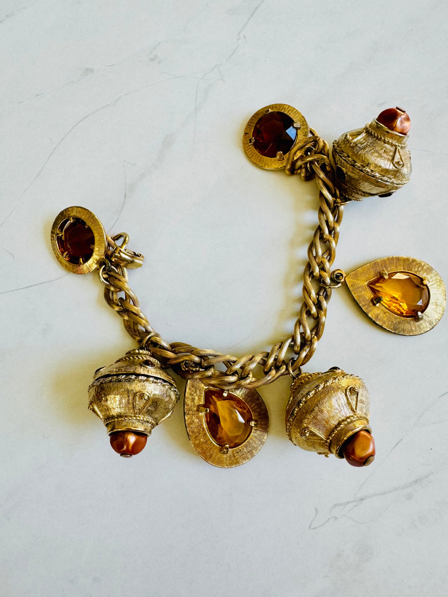 Vintage 1950s jumbo charm bracelet. Gold tone with amber charms