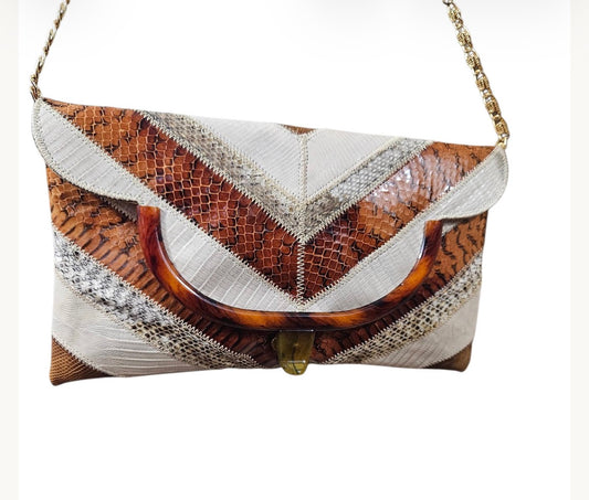 1970s tricolor striped lizard skin envelope style clutch with strap and tortoise colored frame
Vinyl inside.