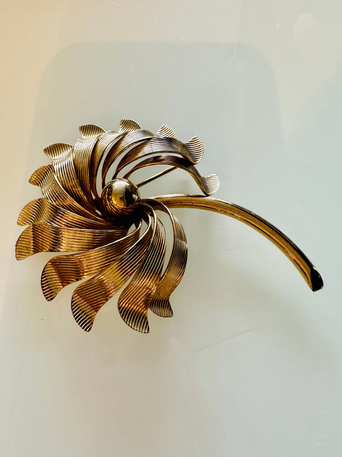 Gold tone flower brooch