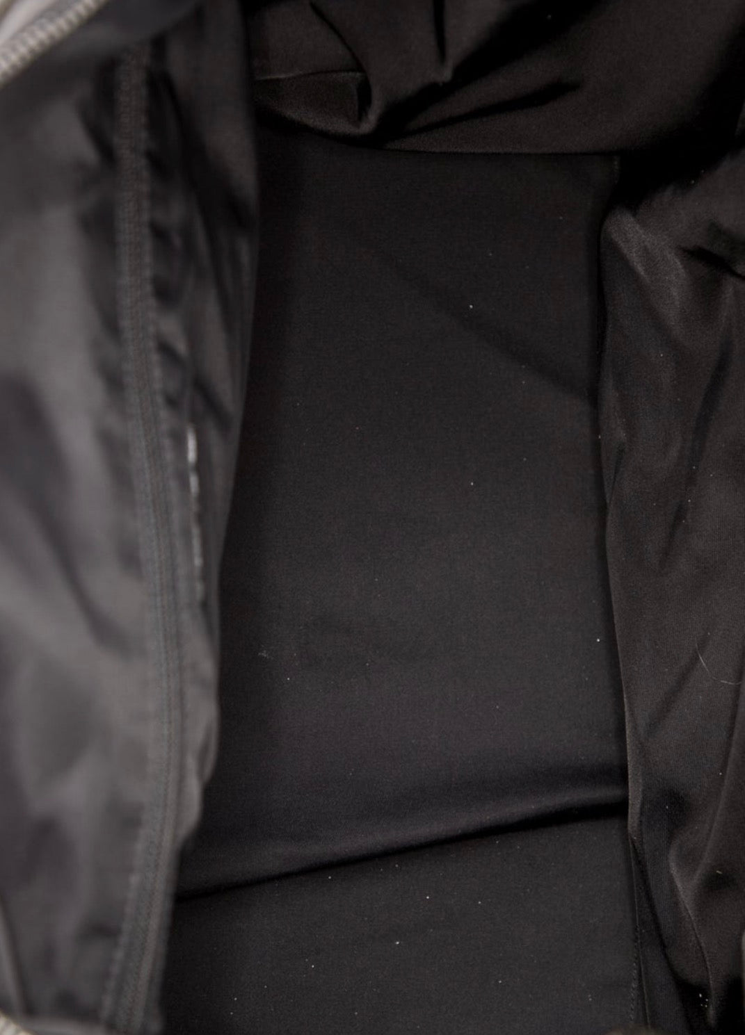 Amazing Chanel Travel Lingne Duffle bag from early 2000 Karl Lagerfeld era. Features nylon lining with two interior pockets.