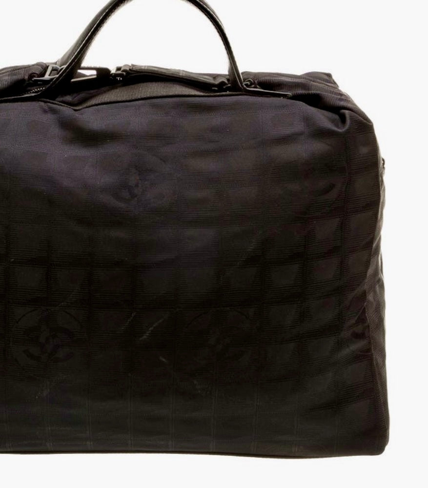 Amazing Chanel Travel Lingne Duffle bag from early 2000 Karl Lagerfeld era. Features nylon lining with two interior pockets.