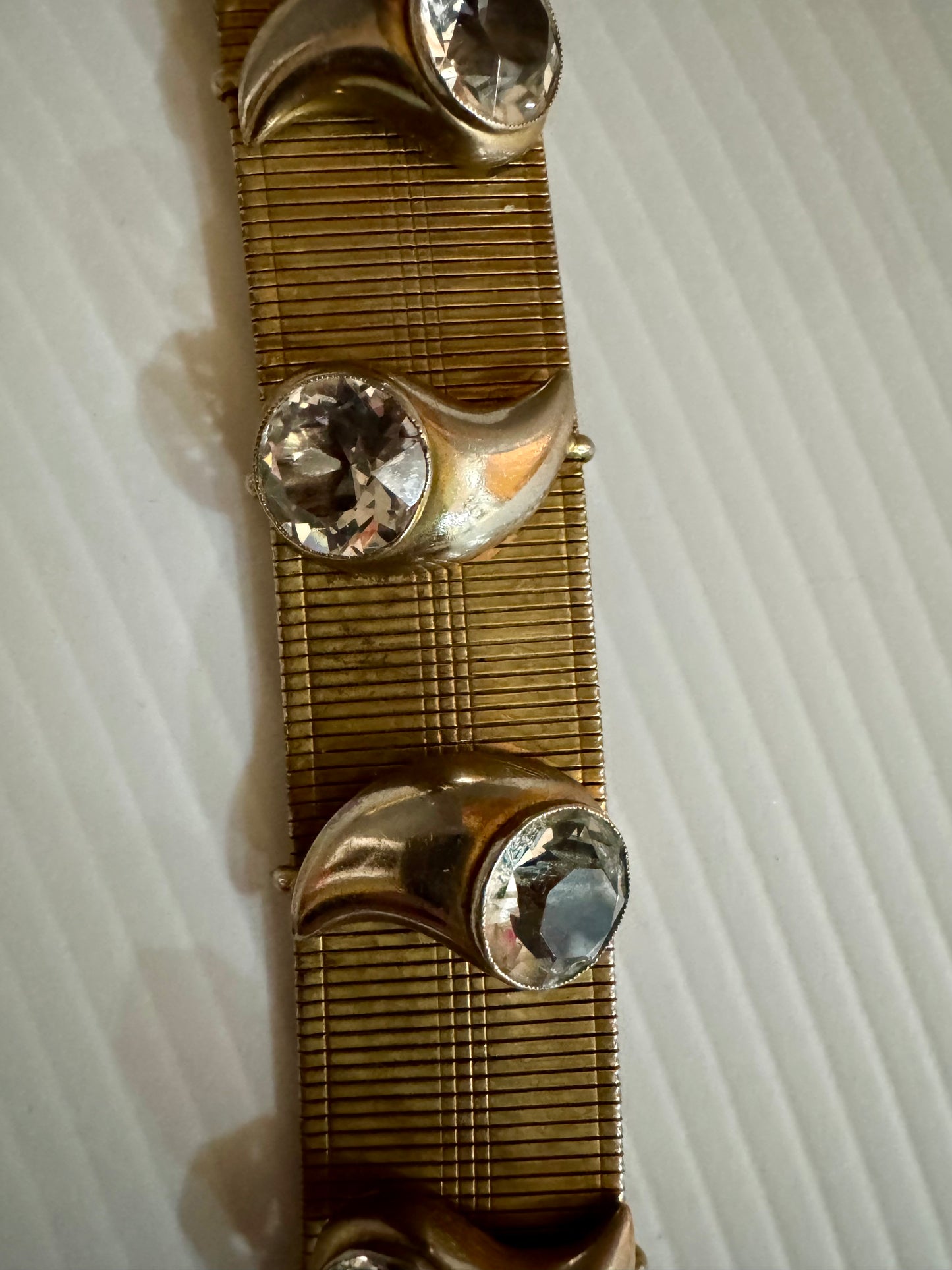 Vintage 1960s gold tone bracelet with rhinestone motifs. Oscar worthy!