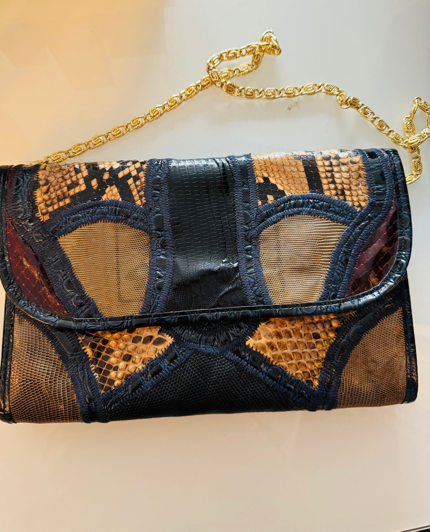 Blue leather and snake skin clutch with gold tone shoulder chain