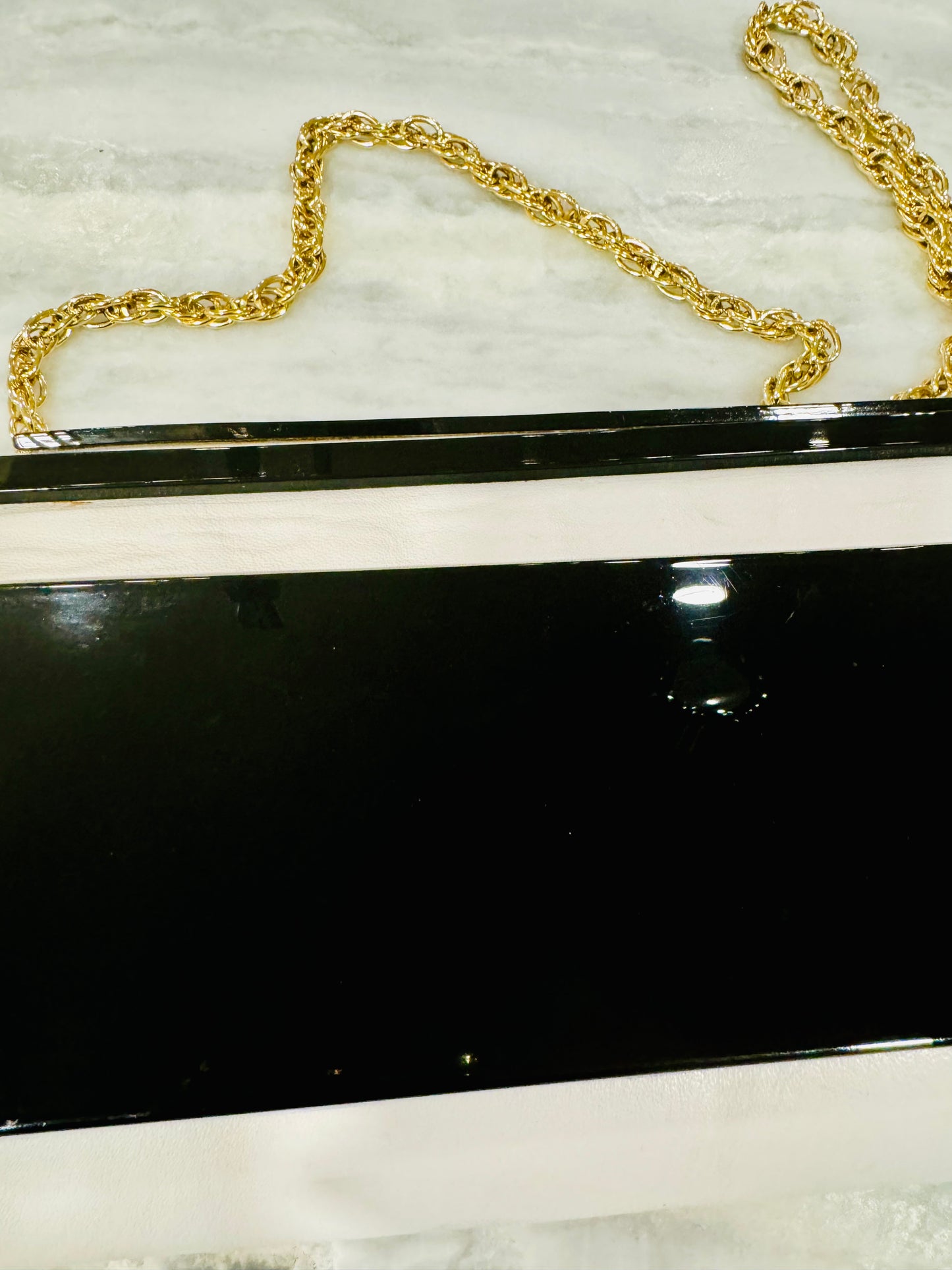 Vintage black lucite and white leather convertible clutch with gold tone chain bag. Made in Italy for Plymouth