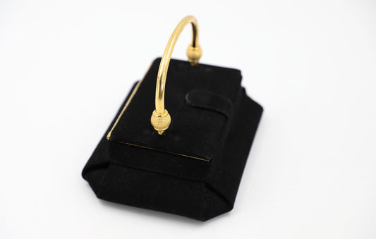 Sophisticated vintage bag in a one of a kind style. This handbag has velvety suede exterior. Pillbox design has art deco vibes. Gilt frame adds structure to the lid and body. Pleated corners. Gold tone decorative hinged handle. Tab with snap closure.