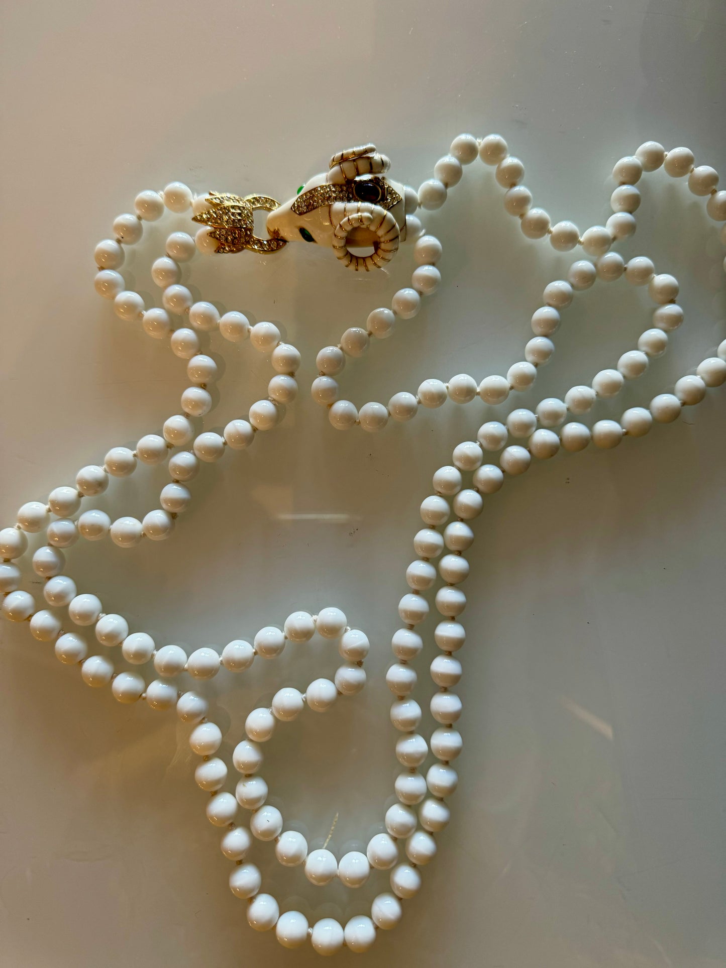 Vintage signed CINER 2 strand RAM necklace with crystal cabochon and hand knotted white glass pearl
beads