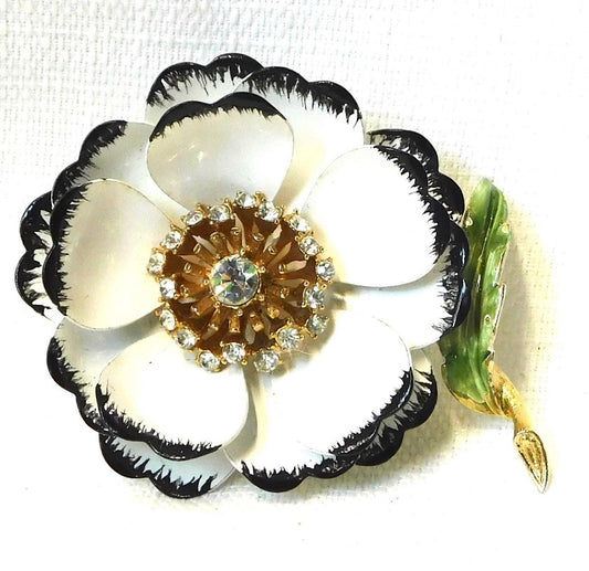 Gorgeous White and Black enamel Flower Brooch.
Multi-layered petals of white w/ black with Gold tone & clear rhinestones pistils.