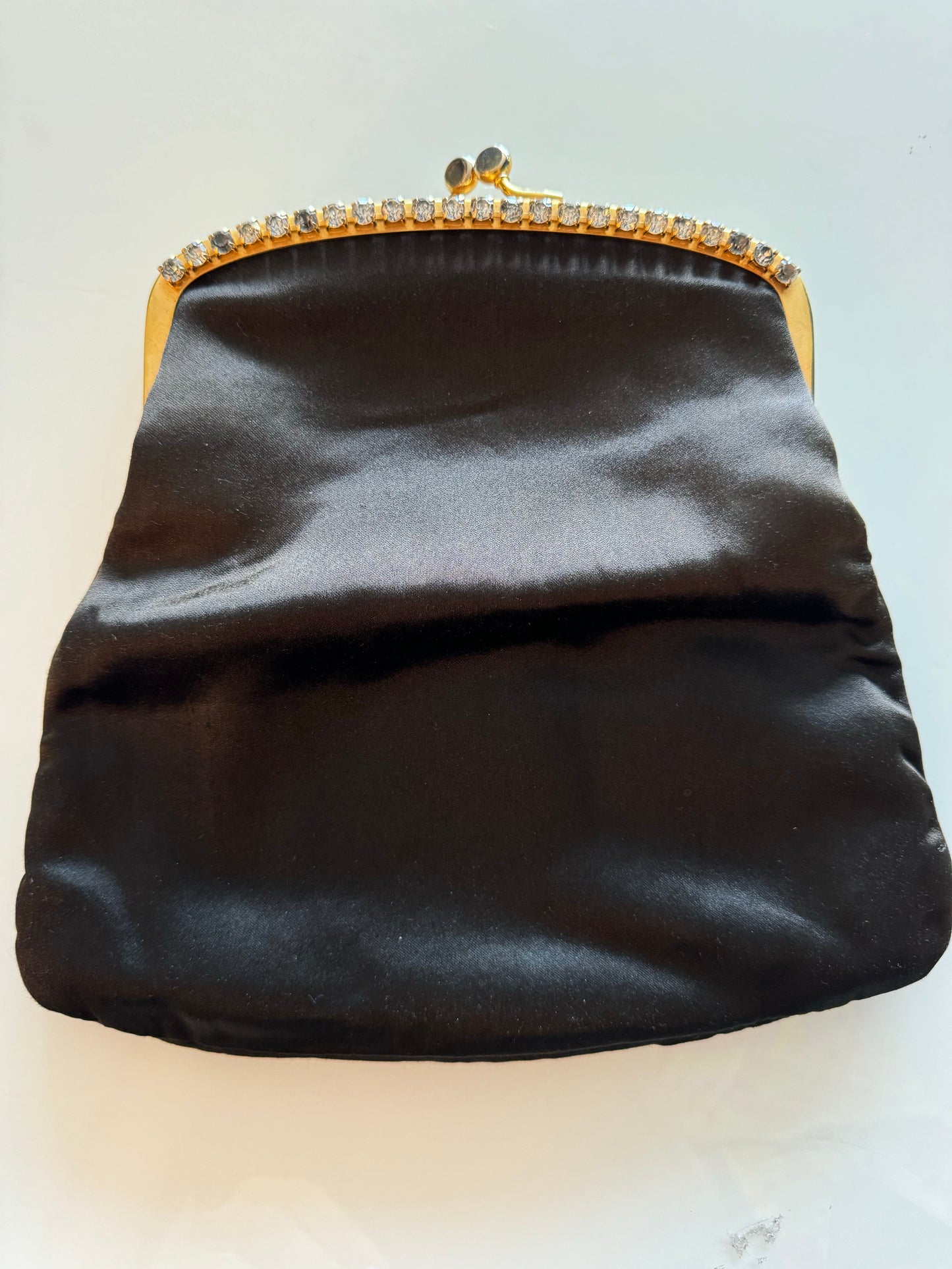 Gorgeous foldover  1950s satin black clutch with rhinestone hardware