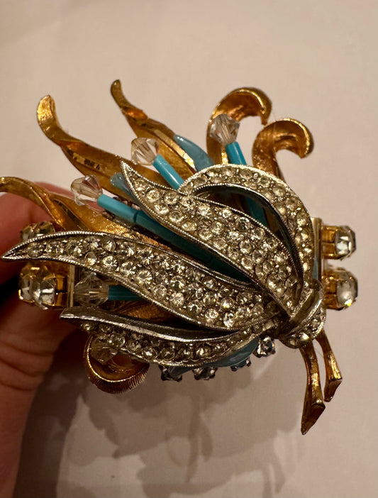 Possibly upcycled gorgeous vintage bracelet featuring a beautiful decorative 1940s brooch/pendant placed on a rhinestone cuff