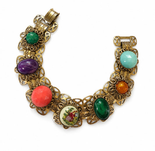 1940's book chain bracelet featuring courting couple and colored cabochon stones