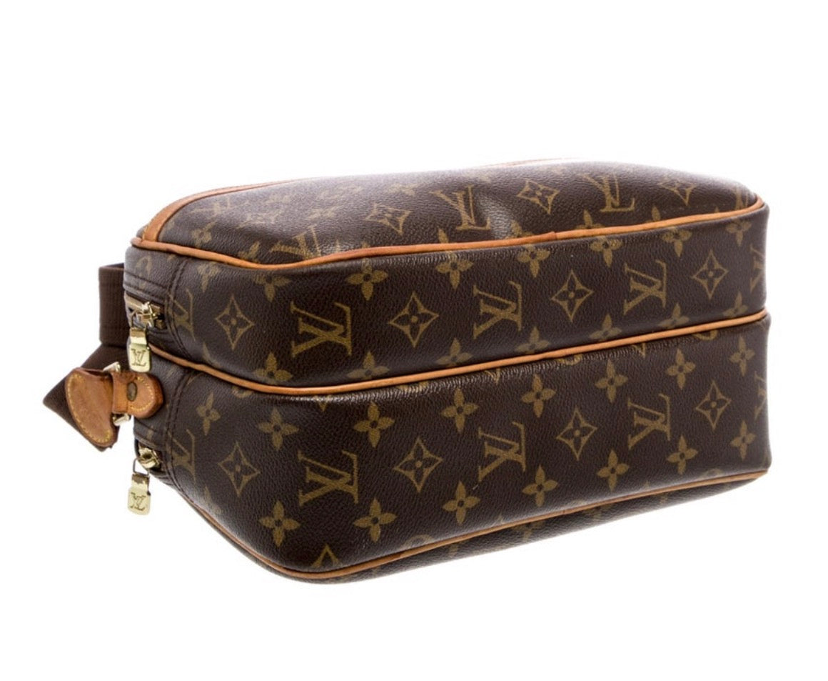 Louis Vuitton reporter bag PM size. Double zip compartments on either side and Crossbody strap.