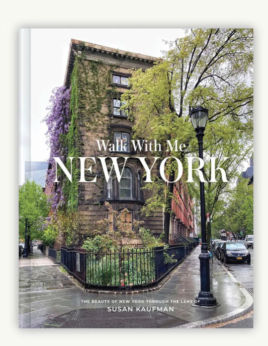 Walk With Me: New York by Susan Kaufman is a photography book that offers an intimate, sidewalk-level view of New York City's charming details, from townhouses and shop fronts to parks and streetscapes, showcasing the city's beauty beyond the hustle.