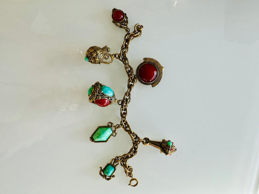 Vintage 1950s charm bracelet with brick and turquoise colored charms