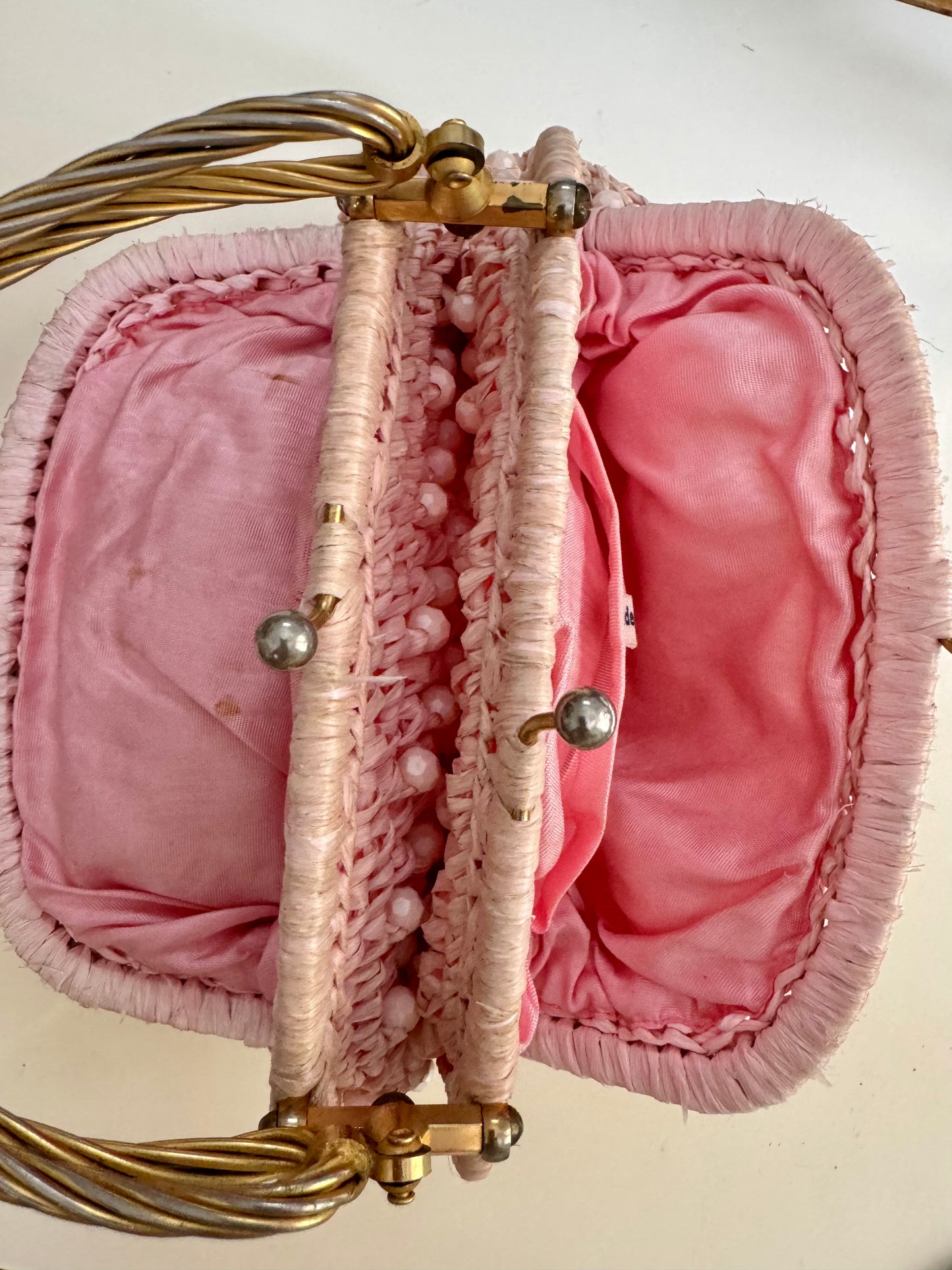 1960s vintage raffia light pink double sided handbag with unique gold hardware