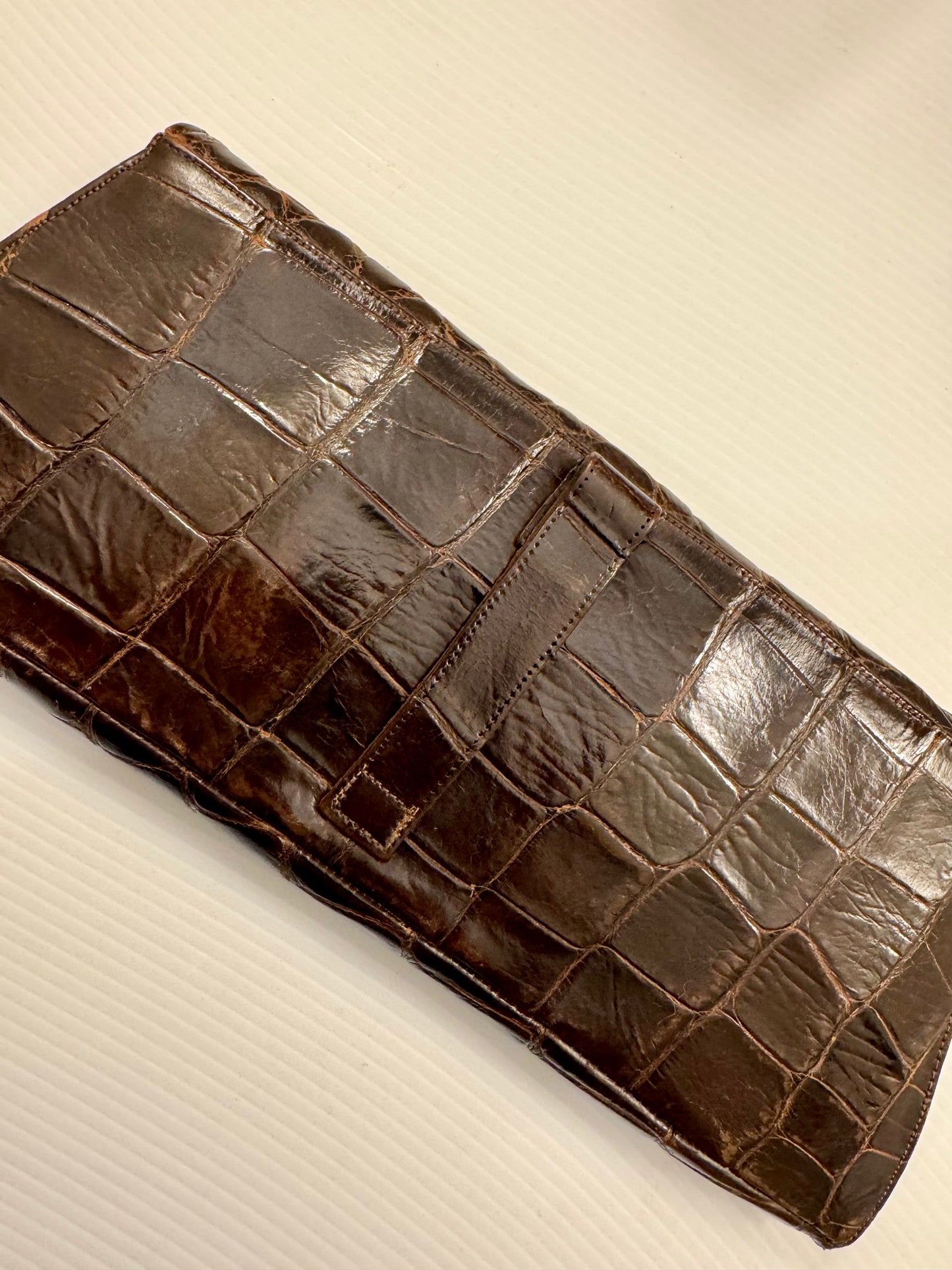 1950s brown crocodile clutch with change purse, original mirror and belt strap in back