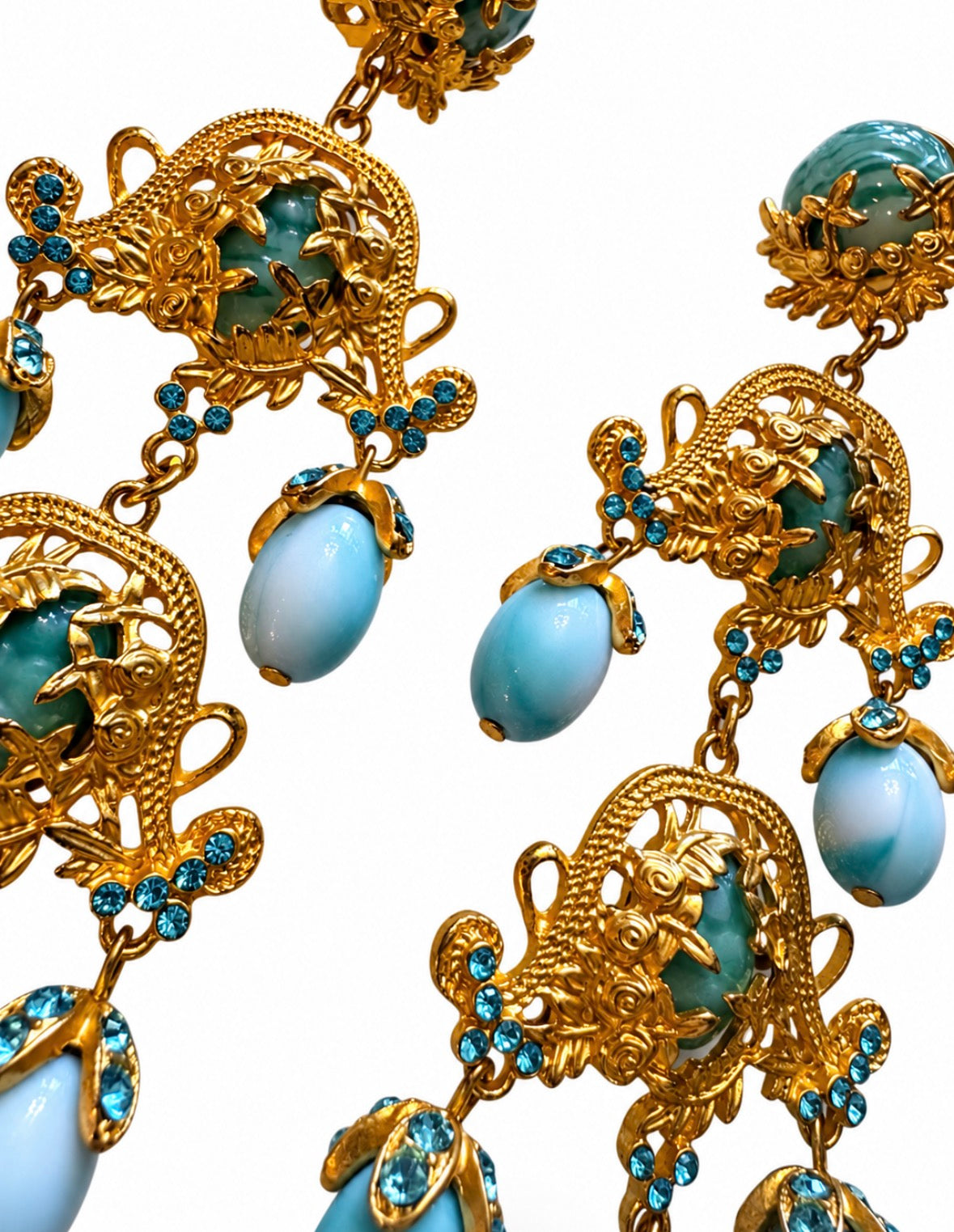 1980s gorgeous dangle clip on earrings with light turquoise colored stones on a gold tone filigree