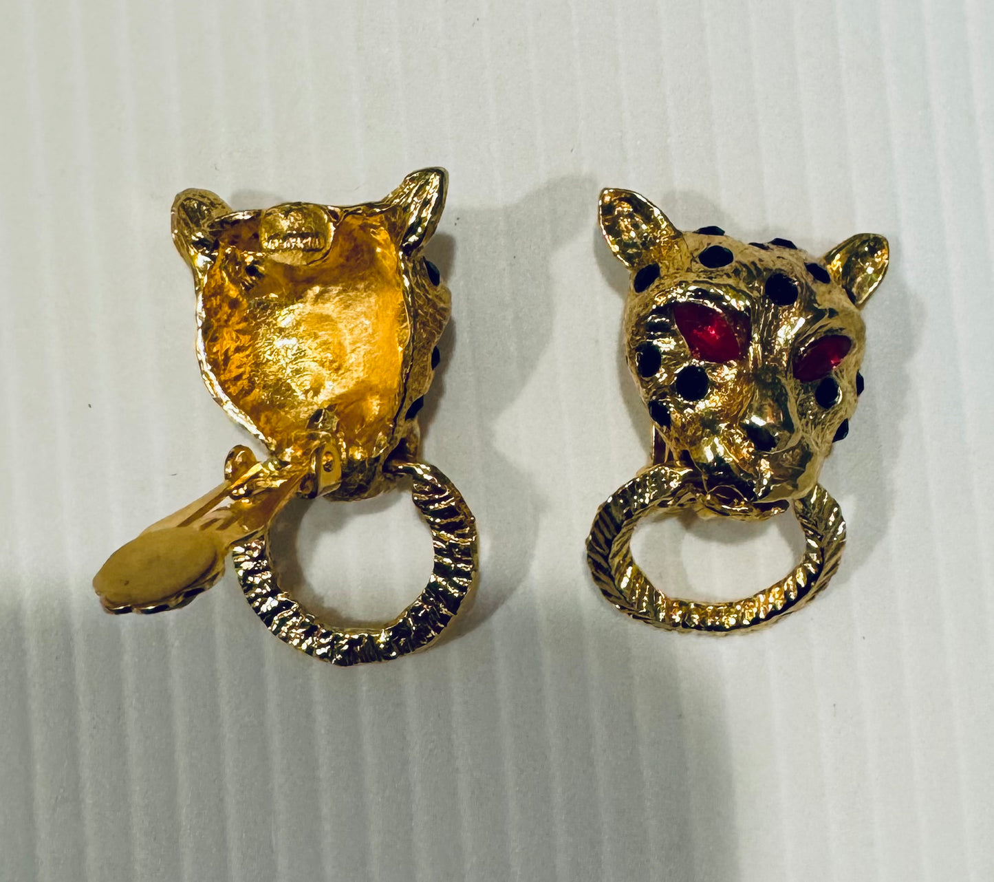 Vintage KJL Kenneth J Lane tiger goldtone clip earrings with black enamel and red rhinestone eyes