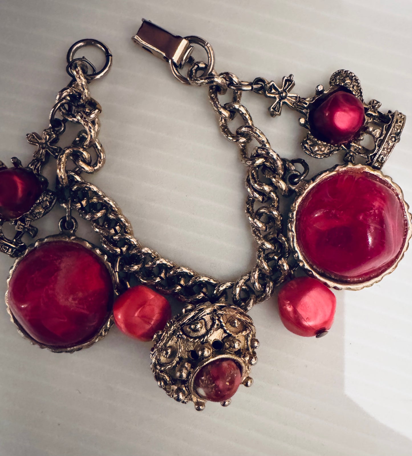 160s gold tone charm bracelet  with chunky pink lucite baubles and crowns