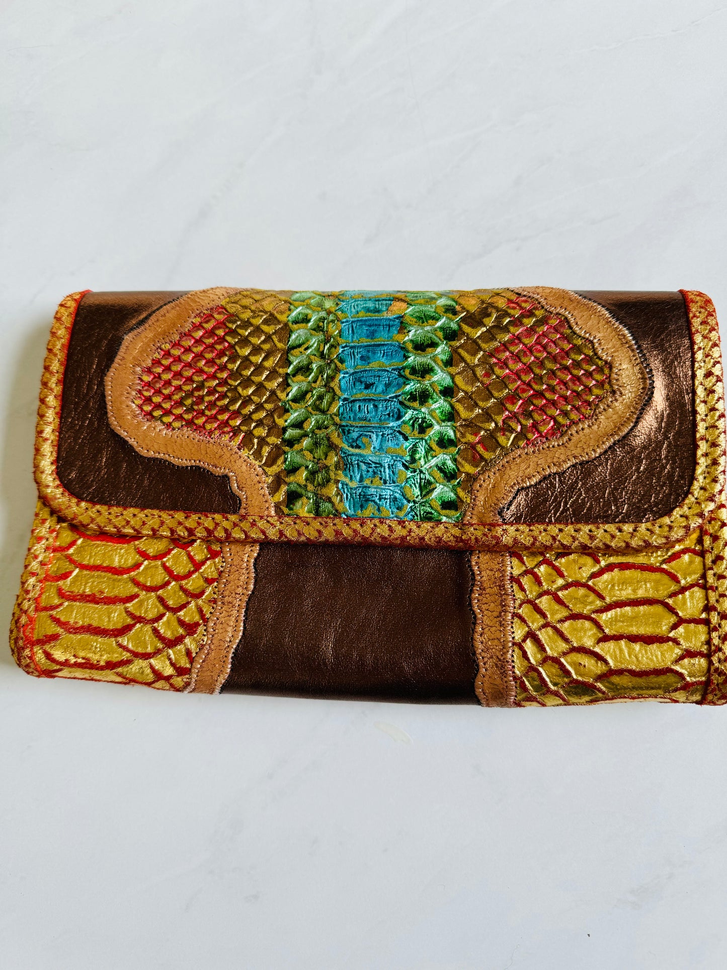 Gorgeous vintage Carlos Falchi clutch with iridescent snake print and bronze colorway