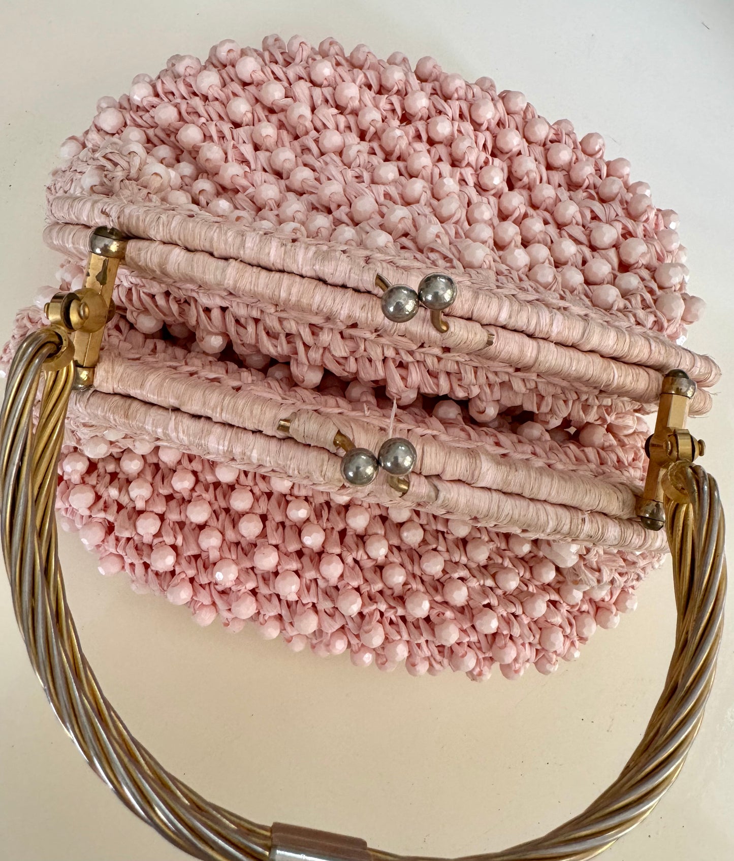 1960s vintage raffia light pink double sided handbag with unique gold hardware