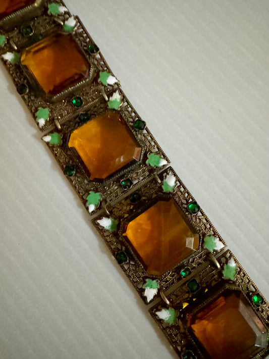 Beautiful 1950s gold tone filigree bracelet with amber color stones and green rhinestones w mini leaf accents