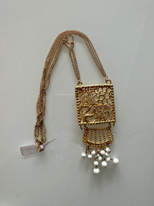 1970s gold tone pendant with white beads