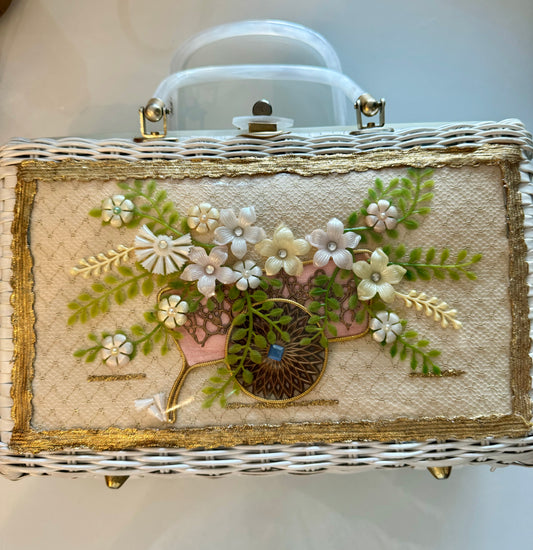 Fun white wicker summer bag 1950s with wagon wheel carrying flowers