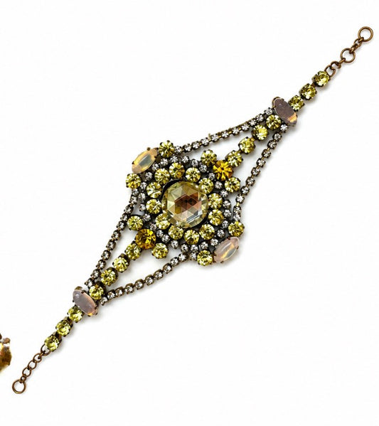 1940s signed BIJOUX M. G. Rhinestone bracelet with pale, yellow and orange rhinestones. A touch of uranium in the glass.
