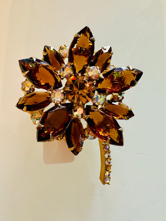 Amber colored rhinestone flower brooch
