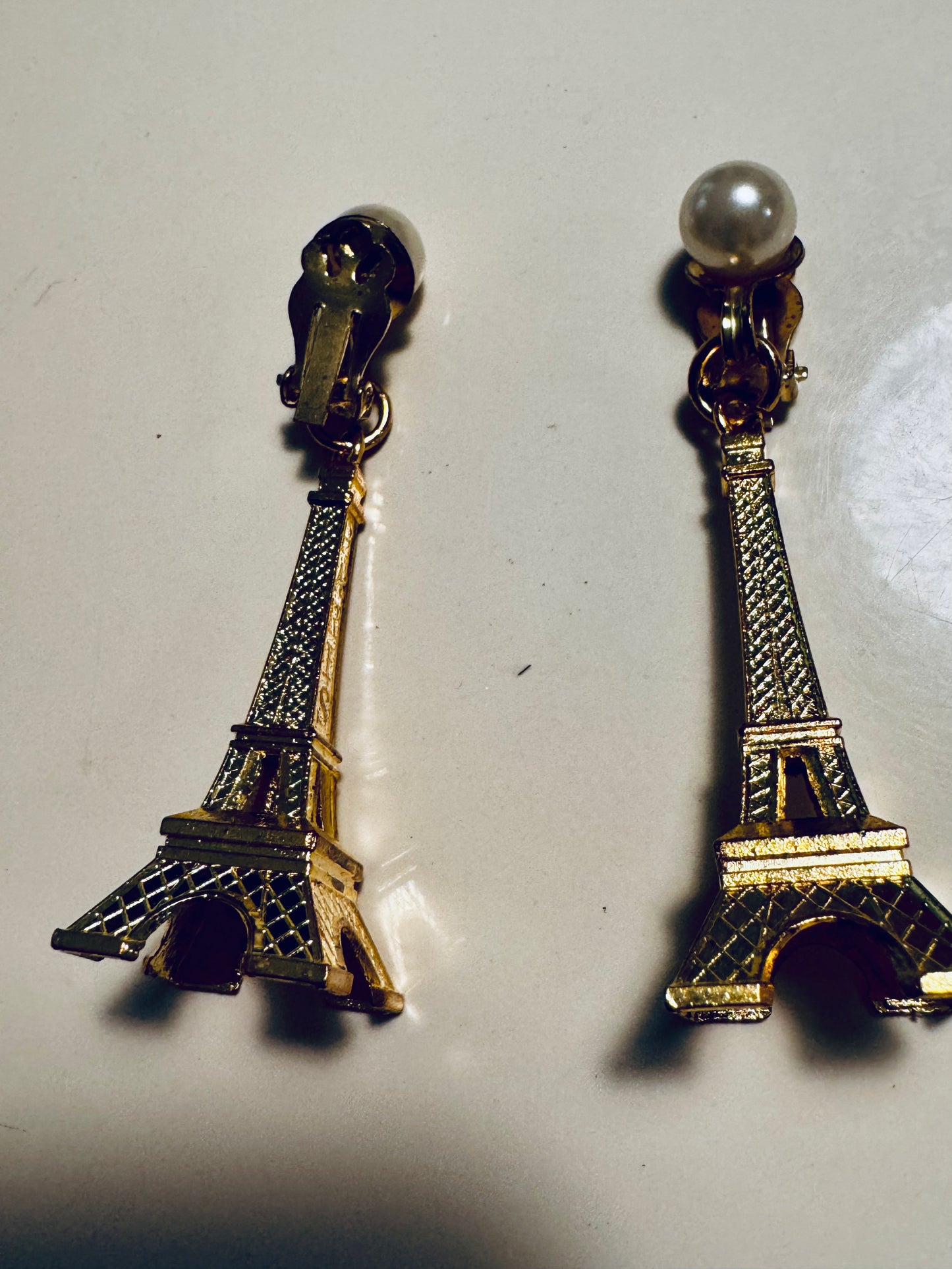 Vintage clip on Eiffel Tower with pearl earrings. From the collection of Linda Fargo