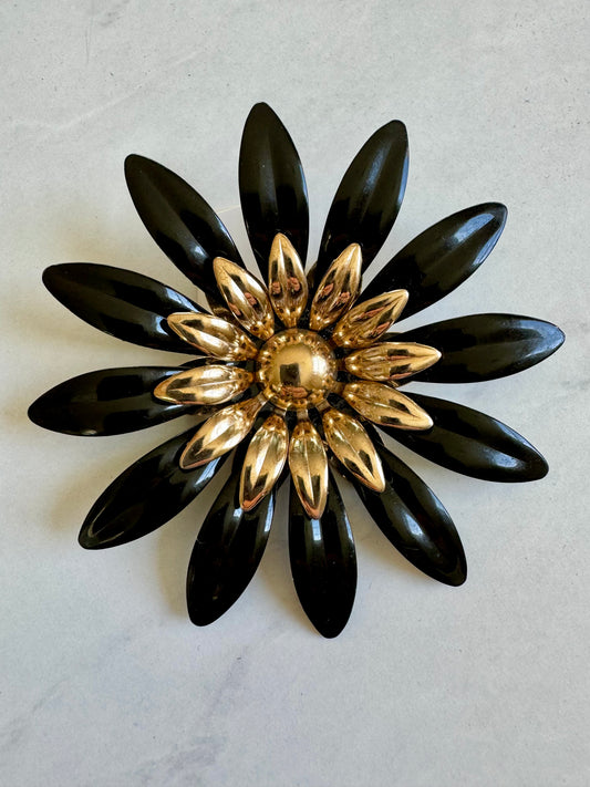 Black and gold Sarah Coventry flower brooch