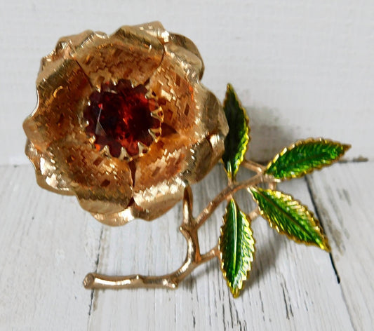 1972  vintage Sarah Coventry gold tone "Ember" flower brooch with topaz colored rhinestone and enamel leaves