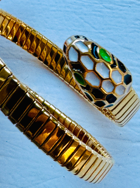 Vintage snake wrap bracelet with black and white enamel head and green rhinestone eyes