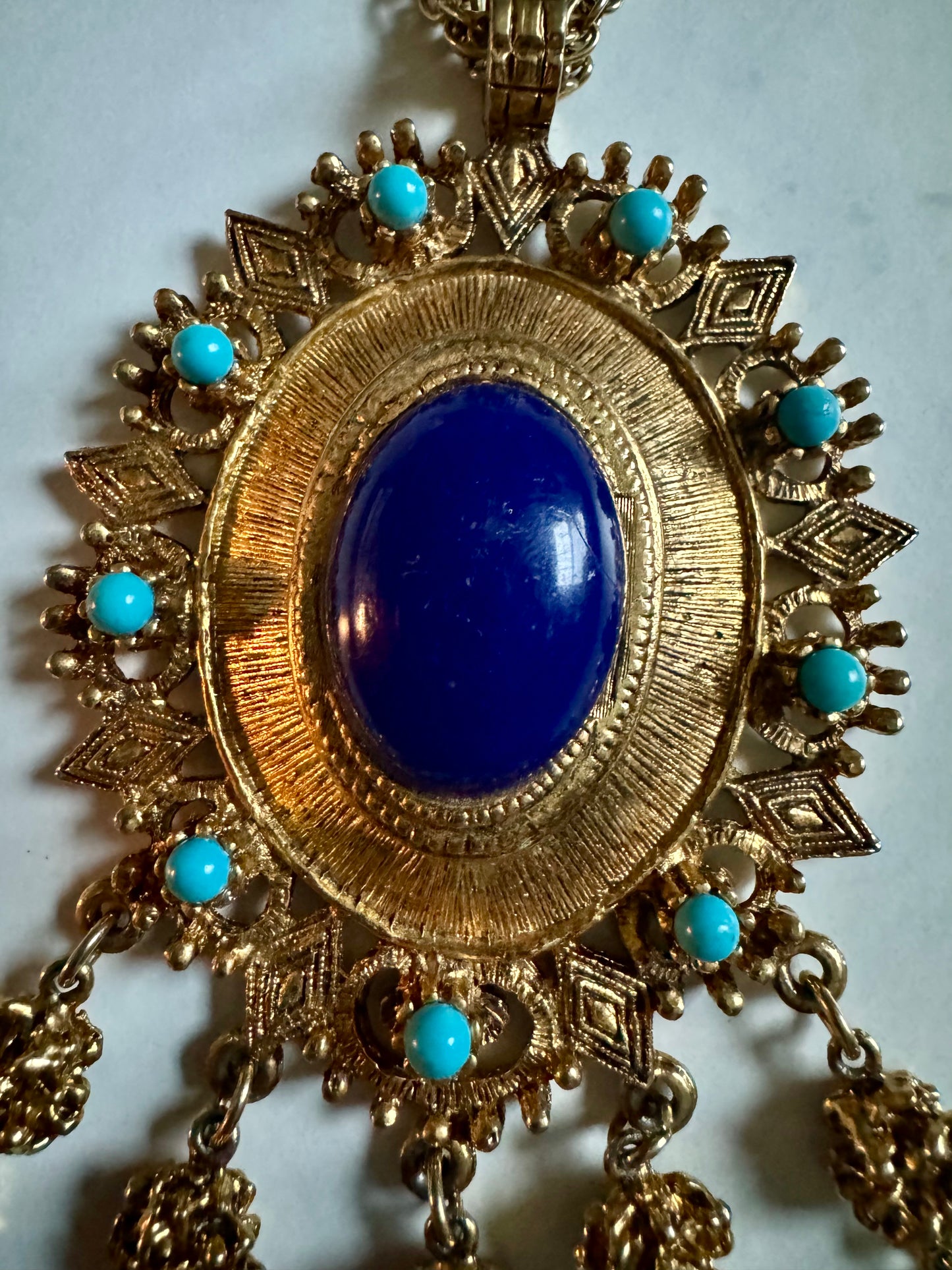 Stunning vintage gold tone necklace with turquoise and blue pendant.