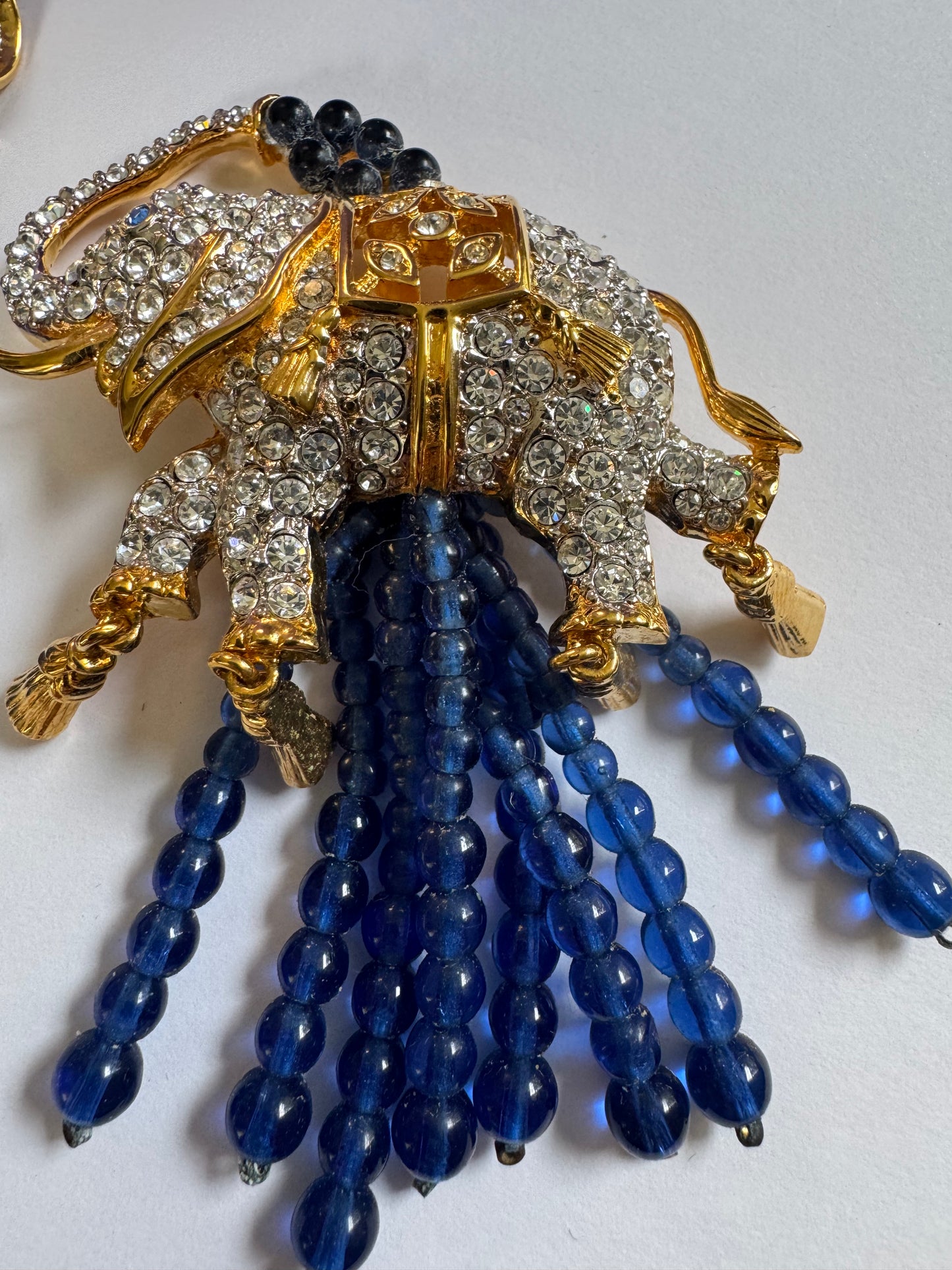 This original Avon set—designed in collaboration with Elizabeth Taylor—features jeweled elephants with cascading sapphire-toned drops.

Symbolizing strength, luck, and glamour… exactly the way Liz wore her jewels.

Complete with the original presentation