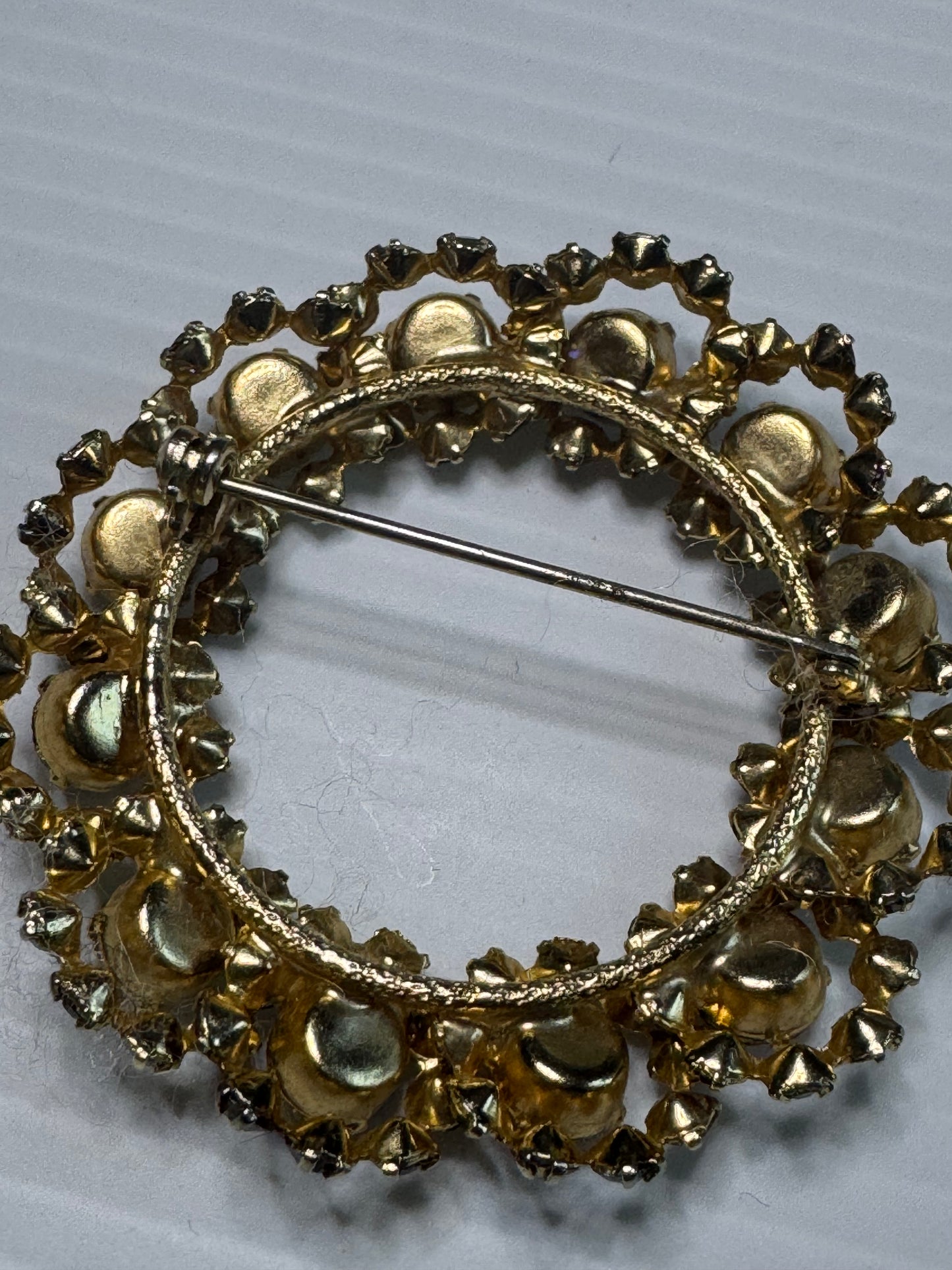1940s unsigned, rainbow colored rhinestone wreath brooch